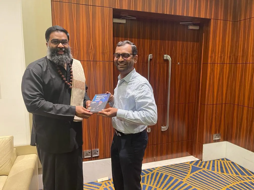 Shankar gifting a signed copy of Billionaire's Mindset & Wealth